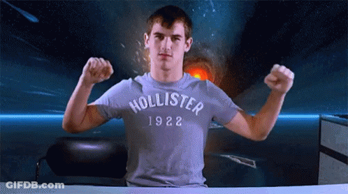Man In Hollister 1922 T-Shirt Flexing Muscles GIF