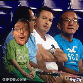 Man In Hollister Shirt Next To Man In Green Shirt GIF