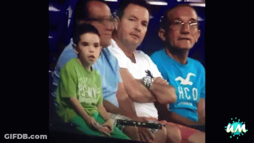Man In Hollister Shirt Sitting Next To Another Man GIF