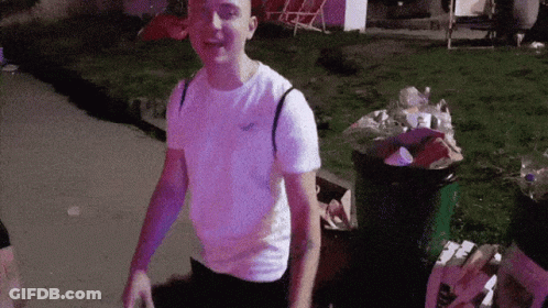 Man In Hollister T-Shirt By Trash Can GIF
