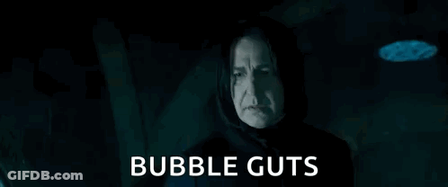 Man In Hood Holding Glass Ball Says Bubble Guts GIF