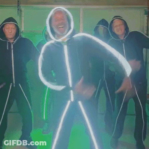 Man In Hooded Jacket Dancing With Group GIF