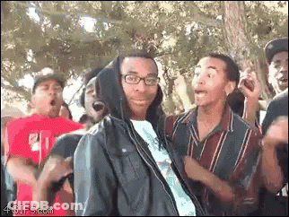 Man In Hooded Jacket Facing Group GIF