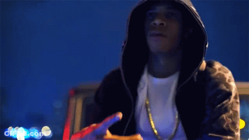 Man In Hooded Jacket Holding Gun GIF