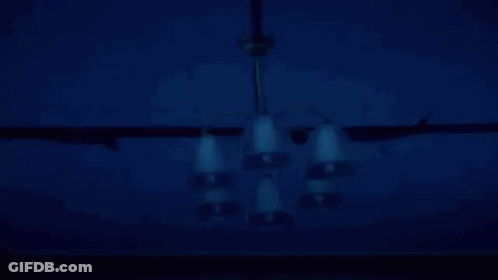 Man In Hooded Jacket Holding Scythe GIF
