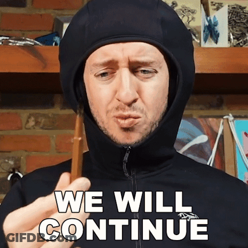 Man In Hooded Jacket Holding Stick We Will Continue GIF