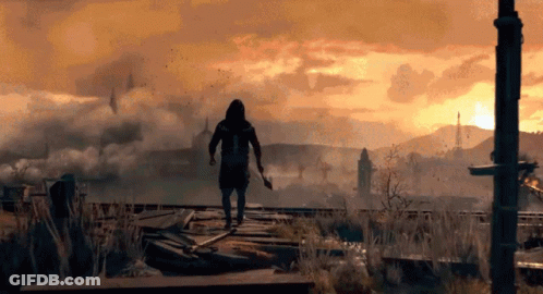 Man In Hooded Jacket Holding Sword In Field GIF