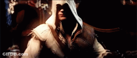 Man In Hooded Jacket In Dark Room GIF