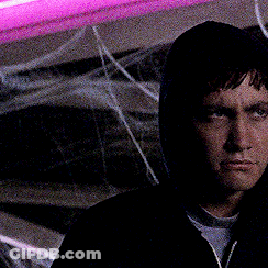 Man In Hooded Jacket Looking At Camera GIF