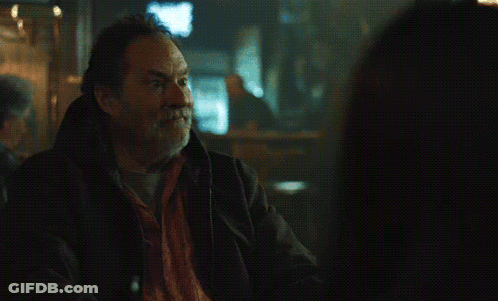 Man In Hooded Jacket Looking Out Window GIF