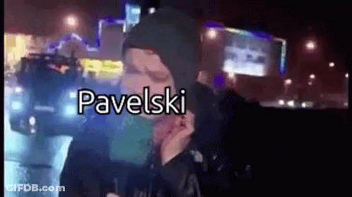 Man In Hooded Jacket Talking On Cell Phone At Night GIF
