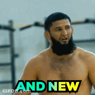 Man In Hooded Jacket Walking Into UFC Room GIF