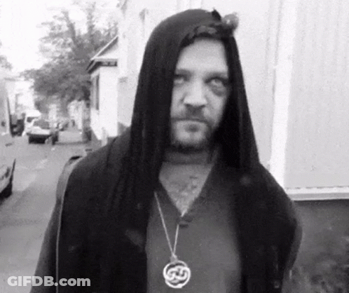 Man In Hooded Jacket With Celtic Necklace GIF
