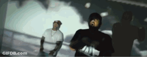 Man In Hooded Shirt Dancing With Man In White Shirt GIF