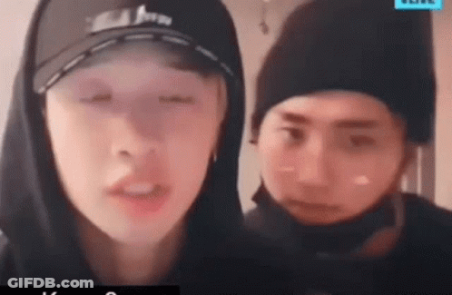 Man In Hoodie And Hat Beside Man In Hat GIF