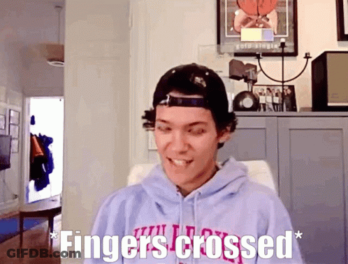 Man In Hoodie And Hat Fingers Crossed GIF