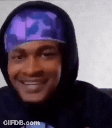 Man In Hoodie And Hat Smiling GIF