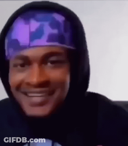 Man In Hoodie And Purple Headband Close Up GIF