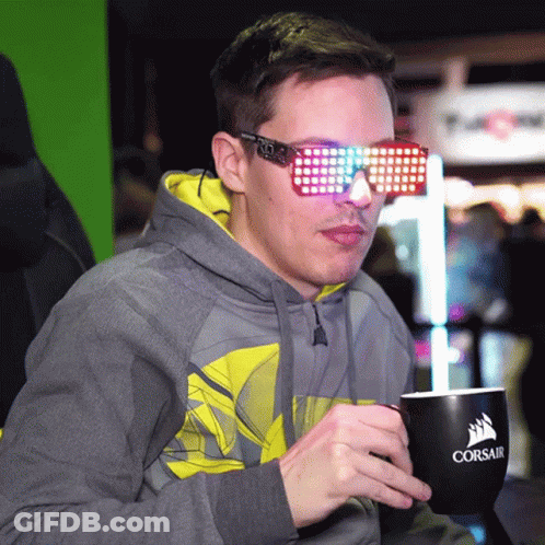 Man In Hoodie And Sunglasses Holding Corsair Mug GIF