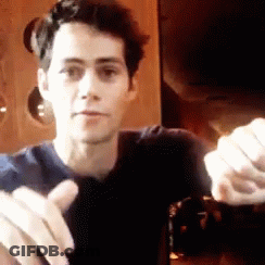 Man In Hoodie And Sunglasses Says Mano Q Confusao In Crowd GIF