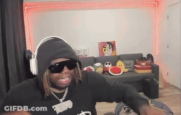Man In Hoodie And Sunglasses Sitting In Living Room GIF