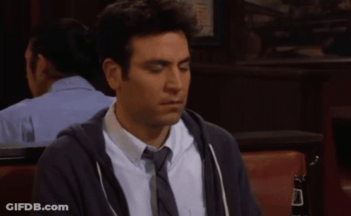 Man In Hoodie And Tie Sitting In Chair GIF