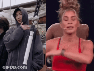 Man In Hoodie And Woman In Red Top GIF