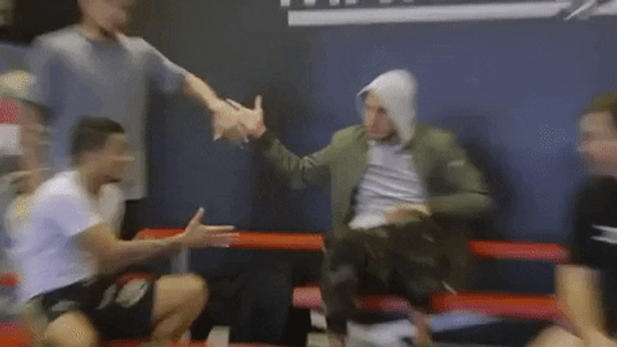 Man In Hoodie Doing Multiple Dap GIF