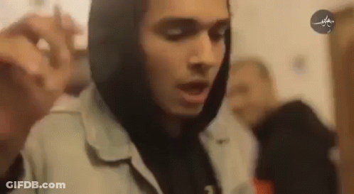 Man In Hoodie Holding Microphone GIF