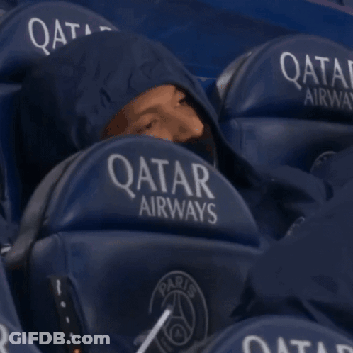 Man In Hoodie Sitting In Qatar Airways Stadium Seat GIF