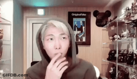 Man In Hoodie Smoking Cigarette In Toy Room GIF
