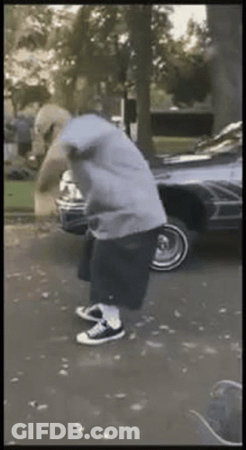Man In Hoodie Standing In Driveway GIF