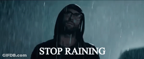 Man In Hoodie Standing In Rain Saying Stop Raining GIF