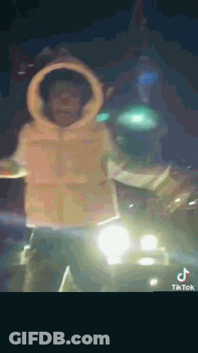 Man In Hoodie Standing Next To Car GIF