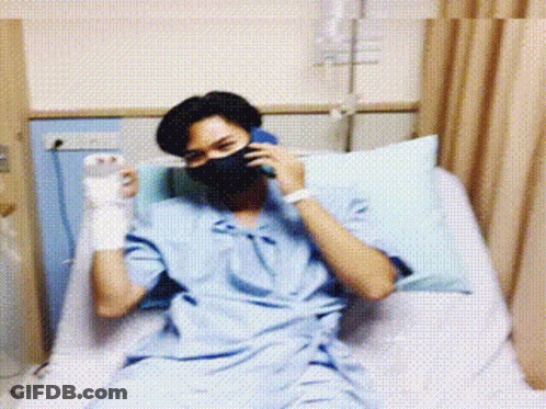 Man In Hospital Bed On Phone GIF