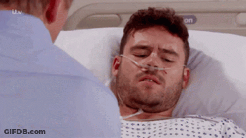 Man In Hospital Bed With Oxygen Mask GIF