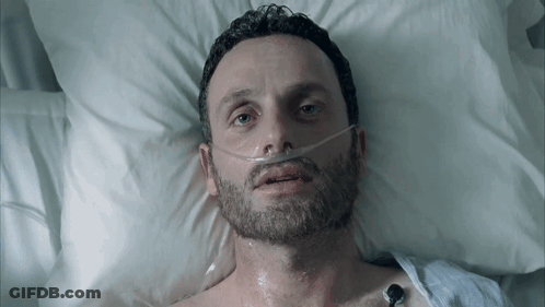 Man In Hospital Bed With Oxygen Mask GIF