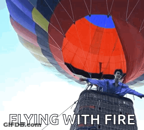 Man In Hot Air Balloon Flying With Fire GIF