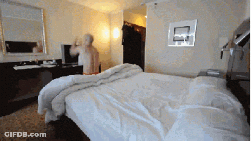 Man In Hotel Room With Basketball Hoop GIF