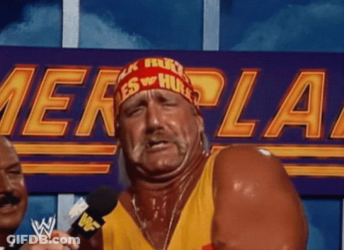 Man In Hulk Hogan Headband Talking Into Mic GIF