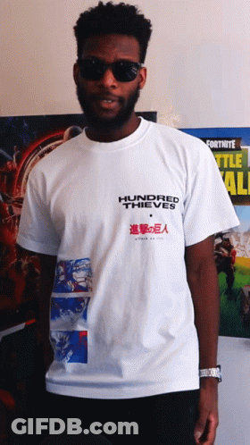 Man In Hundred Thieves T-Shirt In Front Of Fortnite Poster GIF