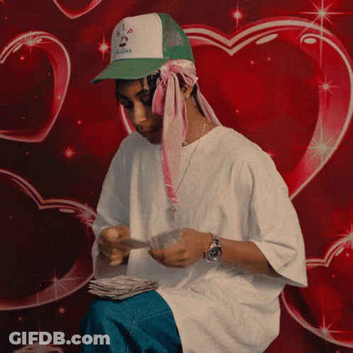 Man In I Love You Hat Holding Stack Of Money GIF