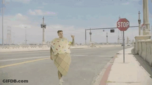 Man In Ice Cream Cone Costume And Dinosaur GIF