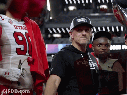 Man In Ichamps Hat Next To Football Player GIF
