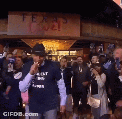 Man In Incident Waiting To Happen Shirt In Front Of Crowd GIF
