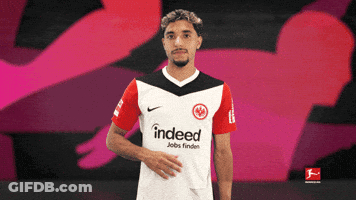 Man In Indeed Shirt On Pink Background GIF