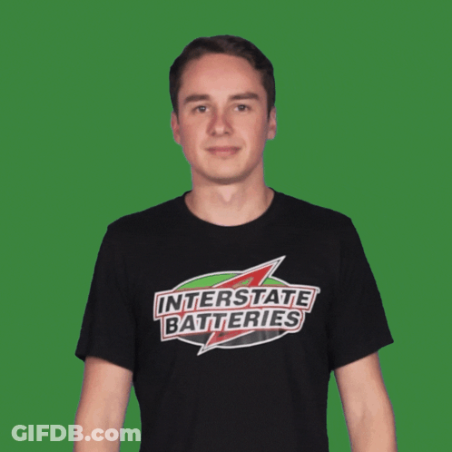 Man In Interstate Batteries T-Shirt Pointing GIF