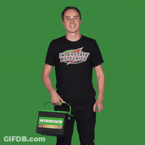 Man In Interstate Batteries T-Shirt Pointing Up GIF