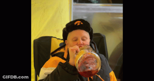Man In Iowa Hat Drinking GIF
