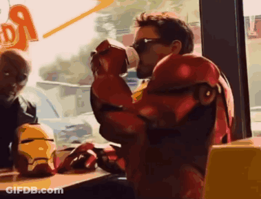 Man In Iron Man Costume Drinking From Cup GIF